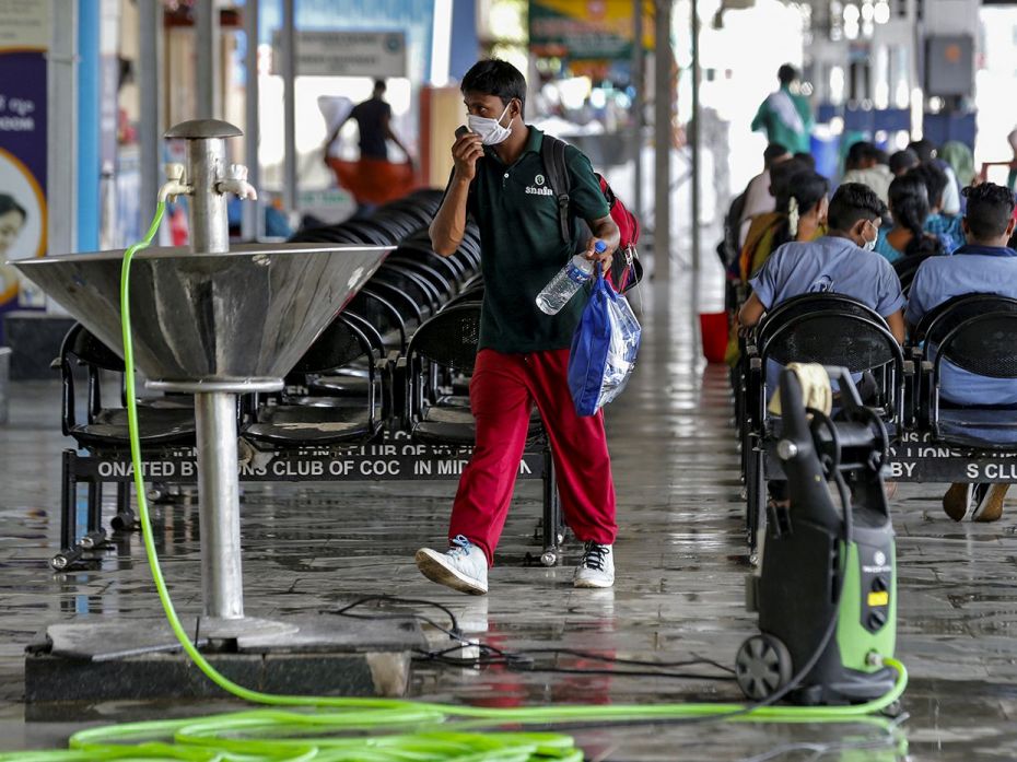 KOCHI, March 15: A passenger wearing a mask walks along a railway platform after the platform was sa