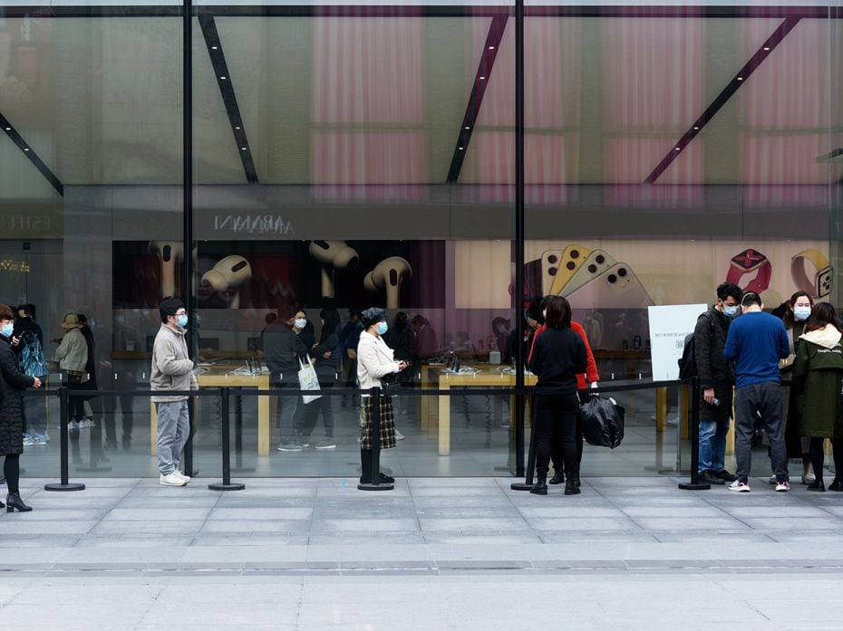 HANGZHOU, CHINA: Customers line up at Apple's West Lake flagship store for a temperature test, as bu