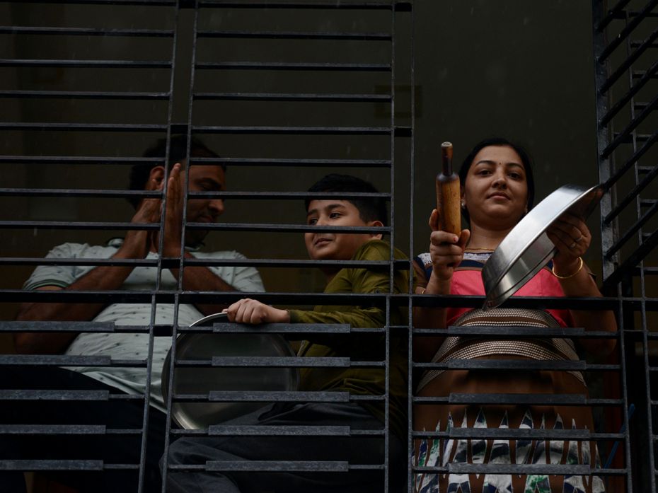 SILIGURI: People gather on a balcony to clap and make noise with kitchenware to thank essential serv