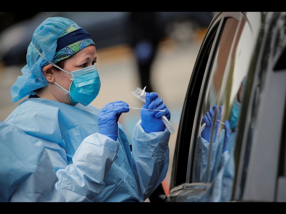 Nurses work at a drive-thru testing site for the coronavirus disease at North Shore University Hospi