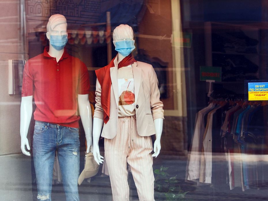 Mannequins in face masks are seen in a shop window during the  quarantine  imposed due      to the C