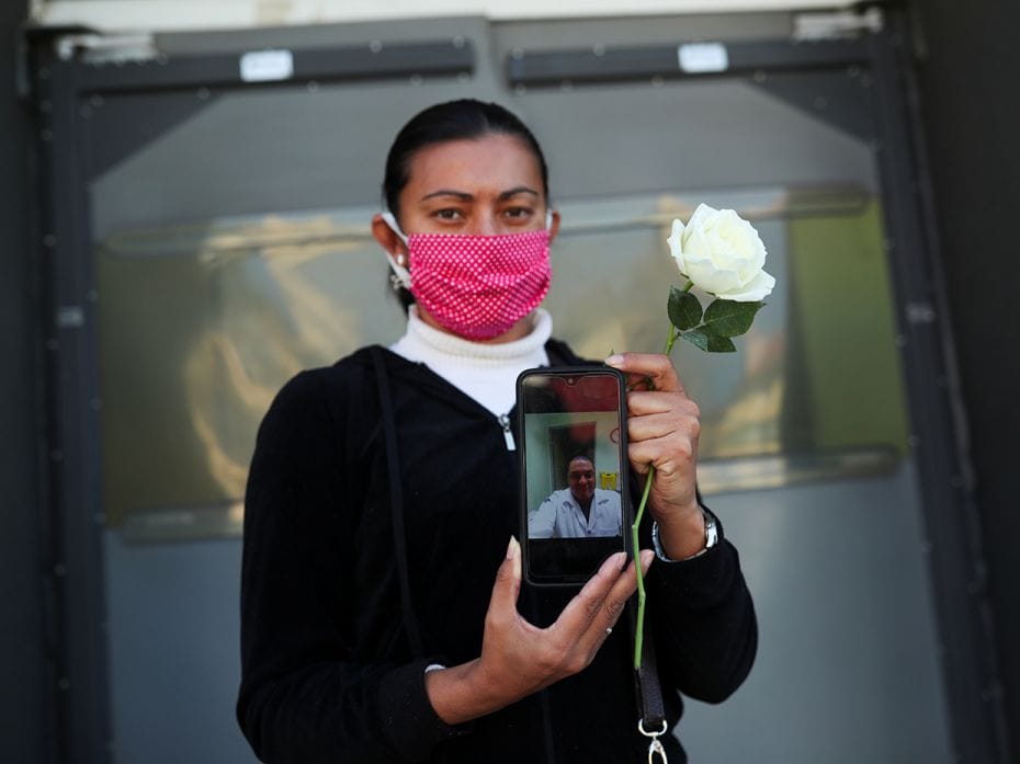 In Sao Paulo, Rosemary Alves Martins, 38, shows a picture of her husband Eduardo Gomes, a nurse who 