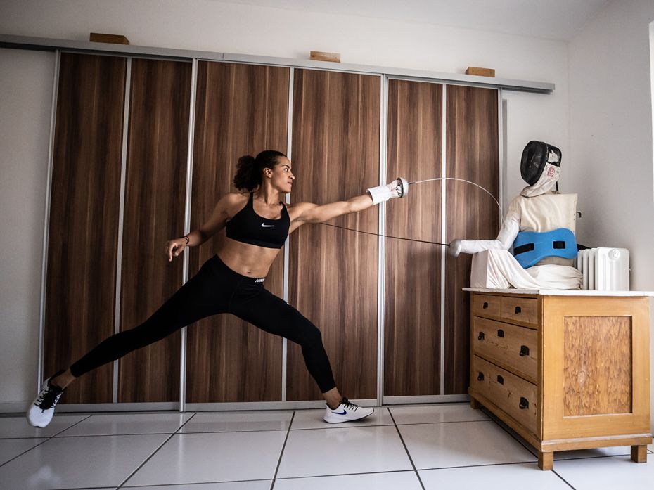 German epee fencer Alexandra Ndolo trains with a self-made puppet in her apartment in Cologne