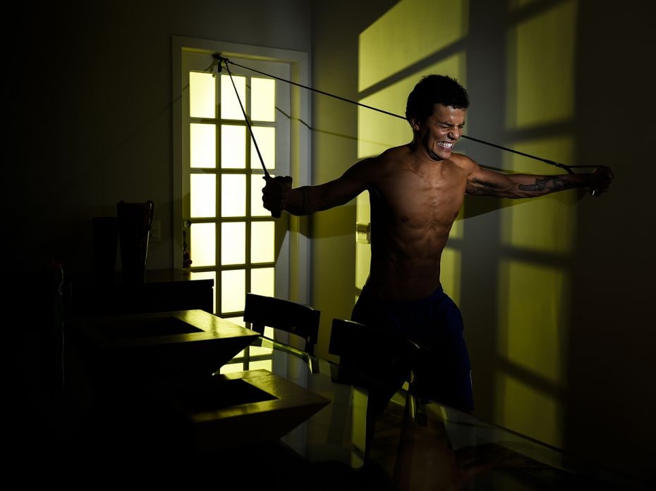 With cases soaring in his country, Brazilian swimmer Miguel Valente trains alone at his home in Belo