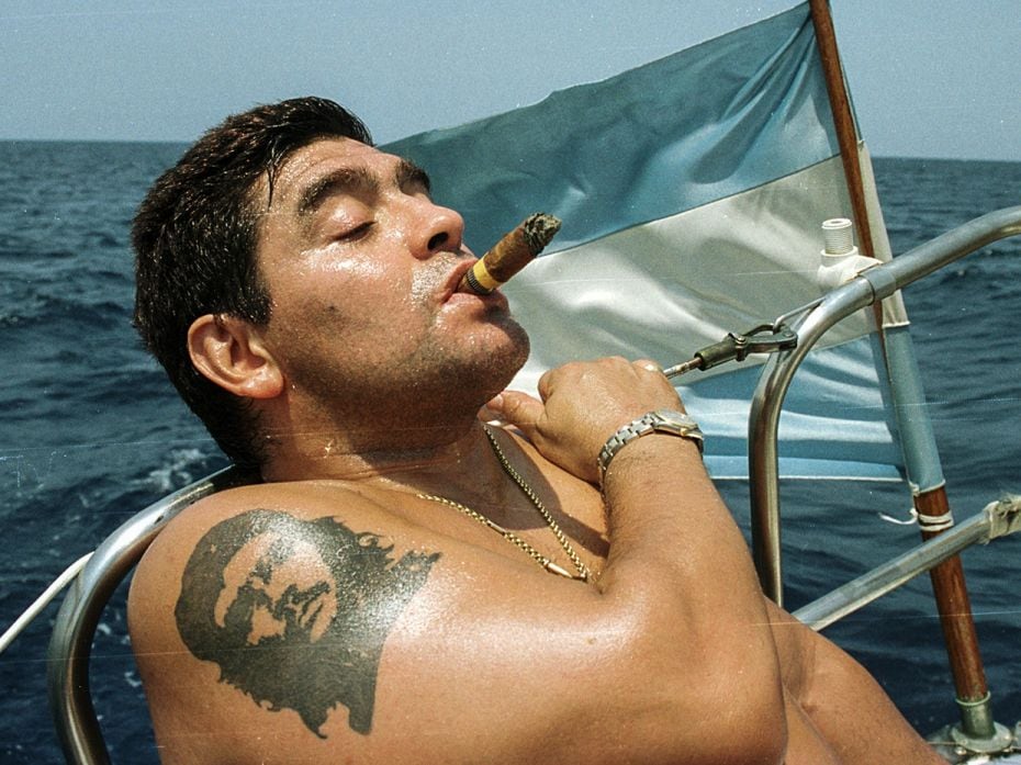 Argentine soccer star Diego Maradona smokes a Cohiba cigar as he rides a sail boat in waters off Hav