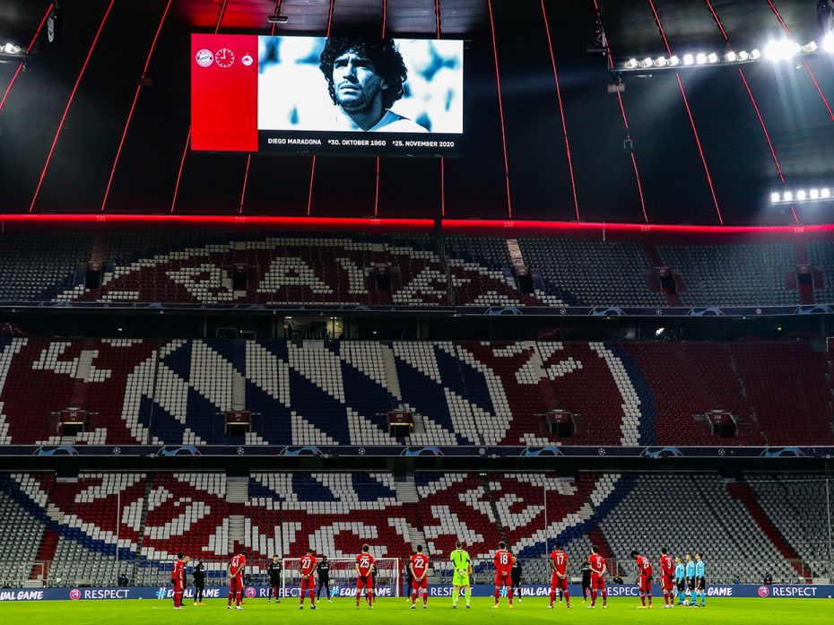 Players and officials take part in a minute of silence to remember Diego Maradona prior to the UEFA 