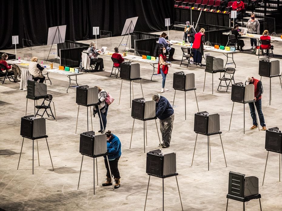 Voters fill out and cast their ballots at the Cross Insurance Center polling location where the enti