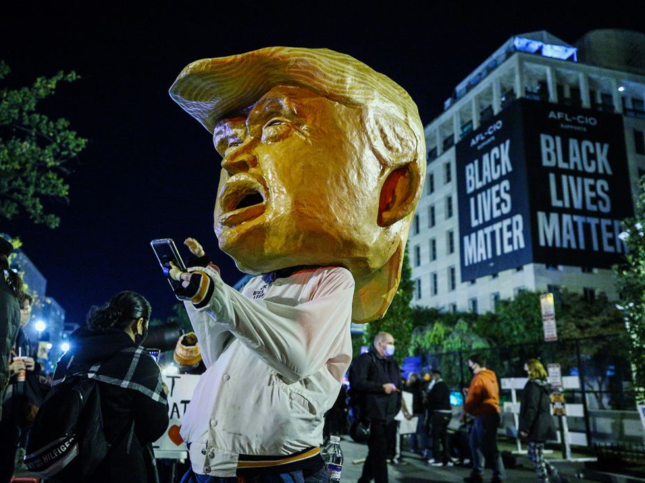 A person dressed as US President Donald Trump is seen in Black Lives Matter Plaza near the White Hou