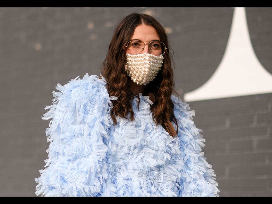 Caroline Vazzana is seen wearing a baby blue dress accessorised with a studded mask outside the Rebe