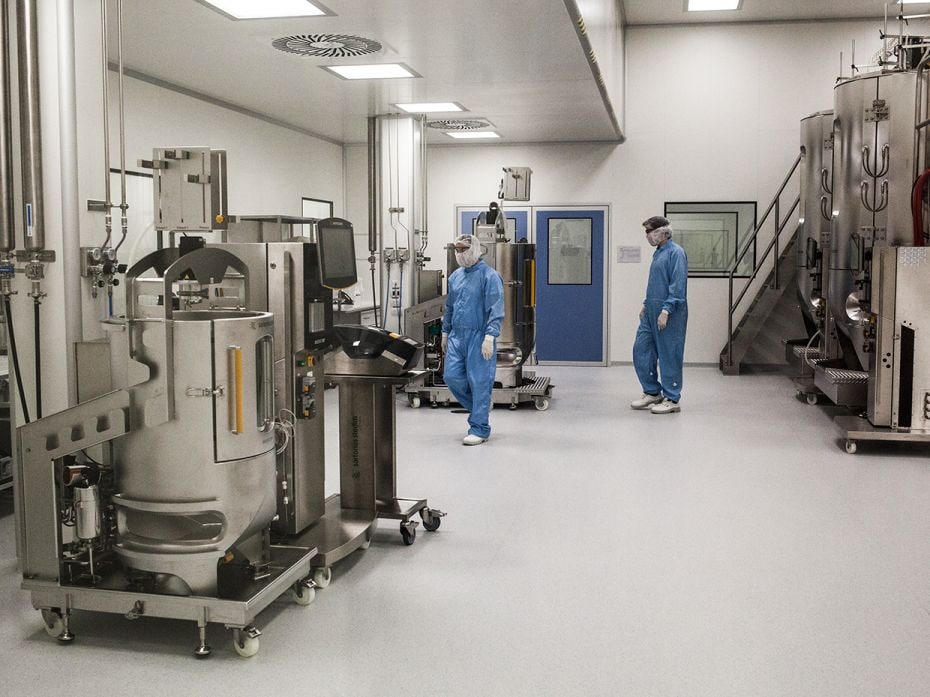 AugustLaboratory workers supervise centrifuges at the production plant of mAbxience, a biotechnology