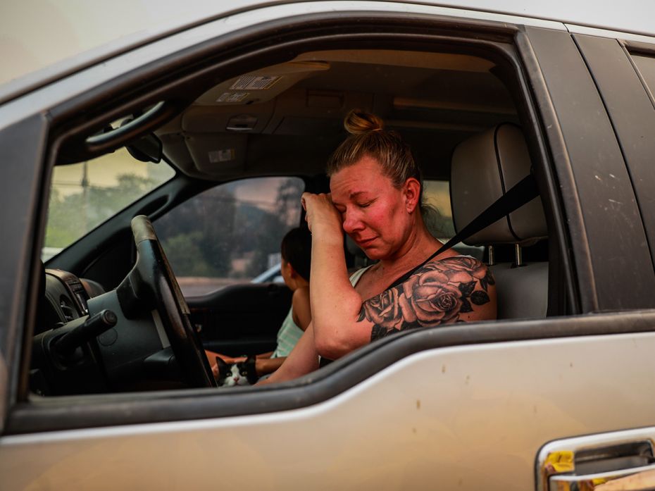 VALLEJO, CA - AUGUST 19: Gina Santos cries in her car after evacuating  the LNU Lightning Complex Fi