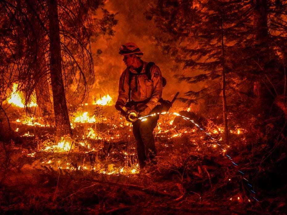 SHAVER LAKE, CA - SEPTEMBER 06: Firefighter Ricardo Gomez, of a Cal Fire  engine from Bradley, takes