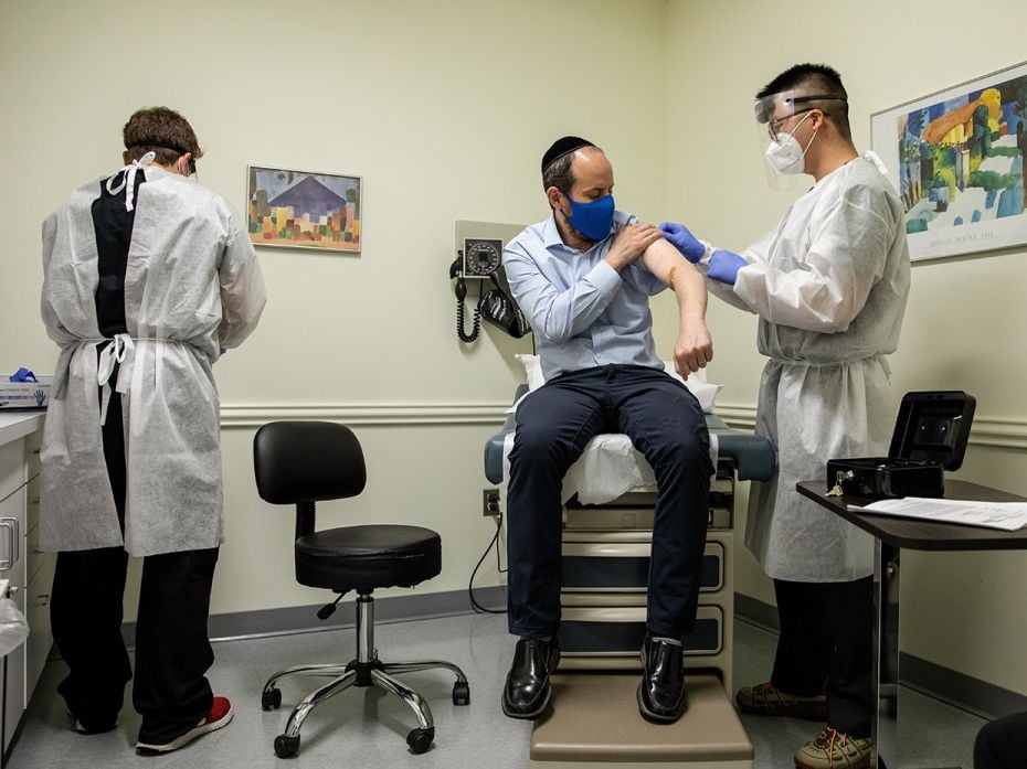 AugustRabbi Shmuel Herzfeld has his arm disinfected by Dr Chao Wang during a clinical trial of biote