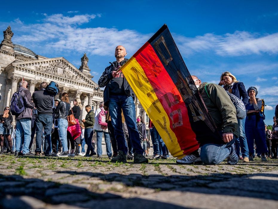 MayIn Germany, people demonstrate in front of the Reichstag building (which houses the German Parlia