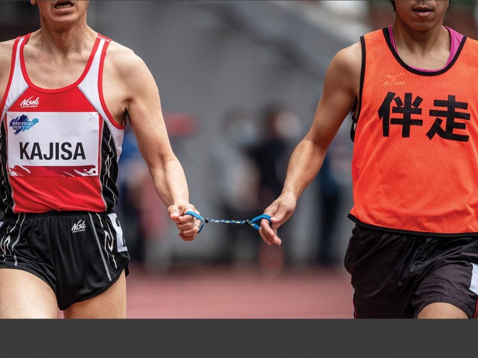 Hiroaki Kajisa (left) of Japan and his guide Satoshi Toyoshima compete in the men’s 1500 m-T11