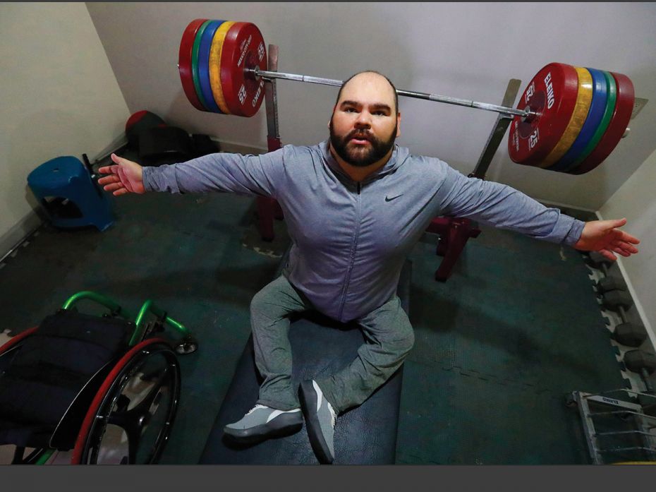 Jose de Jesus Castillo, a paralympic powerlifting medallist, exercises at his residence in Guadalaja