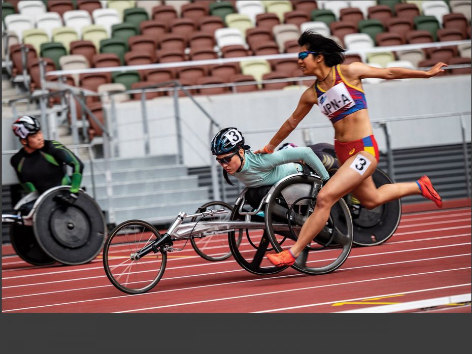 Athletes of Japan’s Team A compete in a 4x100 m universal relay category during a para-athleti