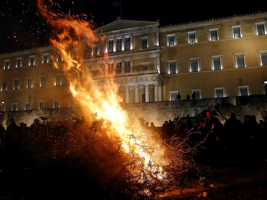 GREECE, 2016
Flames rise as Greek farmers stage a rally against pension reform—which would br