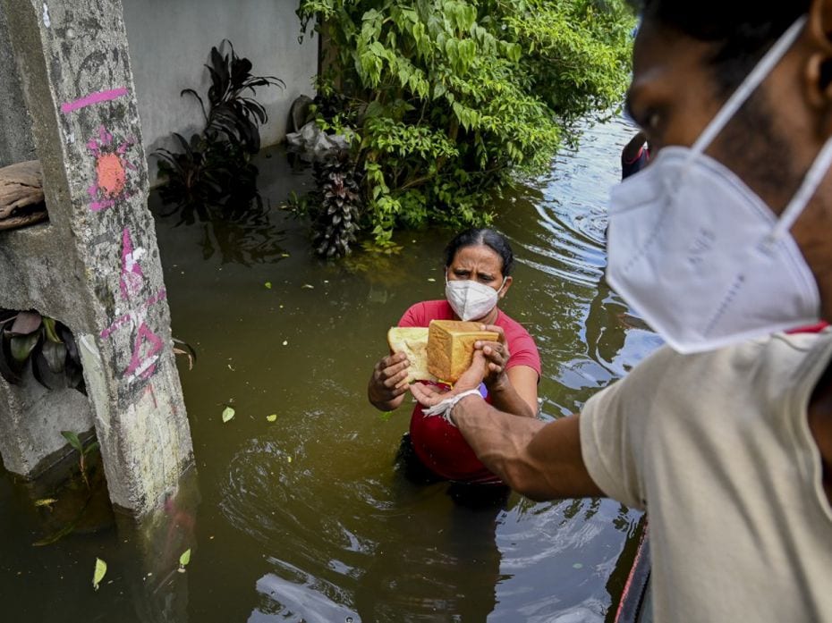 Sri Lanka
A Sri Lankan Army personnel distributes food to flood victims after heavy monsoon rains i