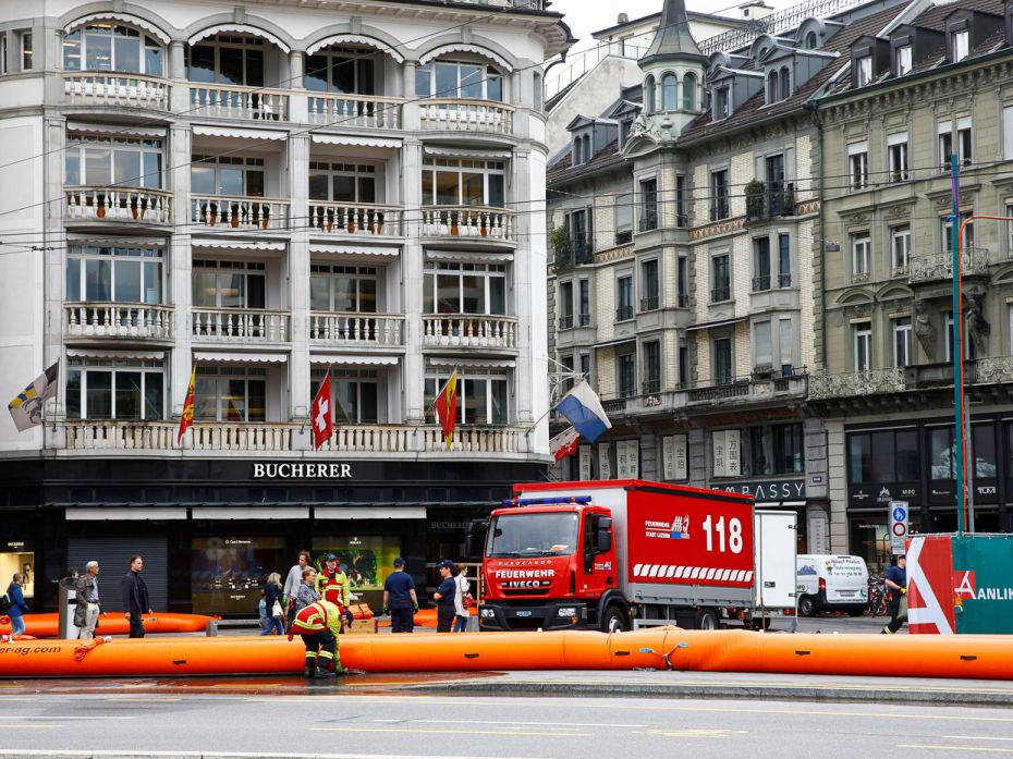 Switzerland
Firefighters install a mobile inflatable barrier against floods on the Schwanenplatz sq