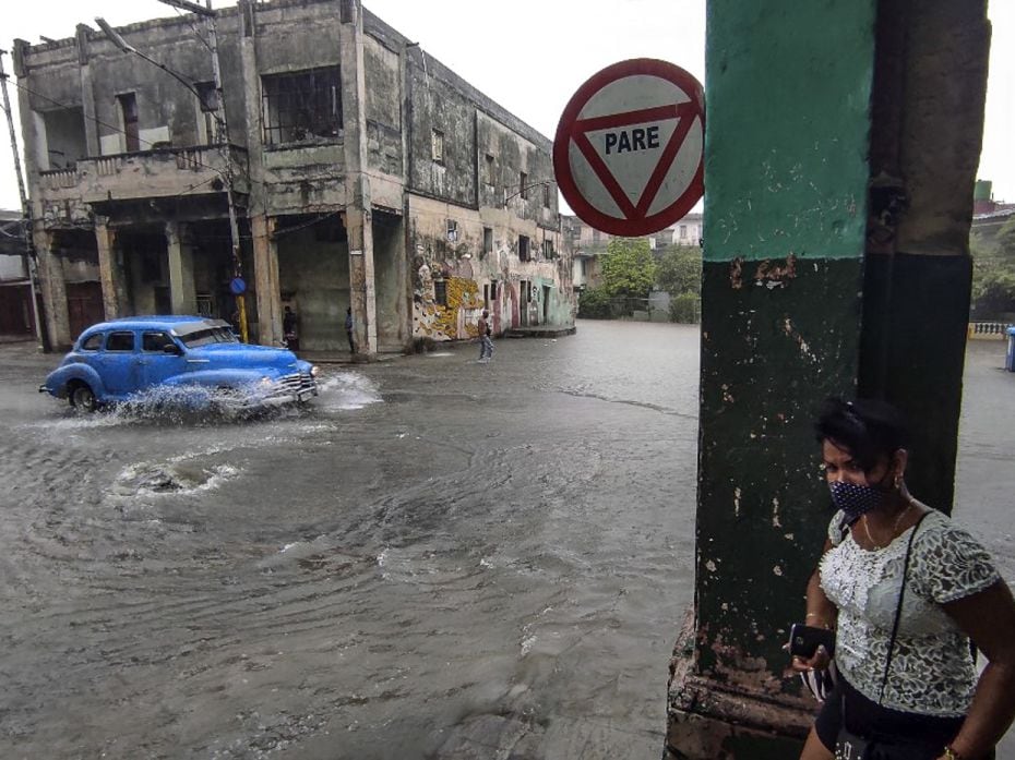 CubaA classic American car drives along a flooded street at the 10 de Octubre municipality in Havana