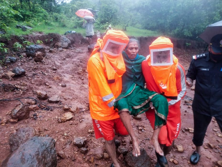 India 
A National Disaster Response Force team carry a woman to safety during a resc