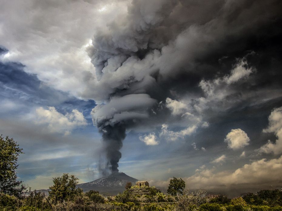 Ash plume during the paroxysm at southeast crater of the volcano Dec 04, 2015. Belching out a toweri