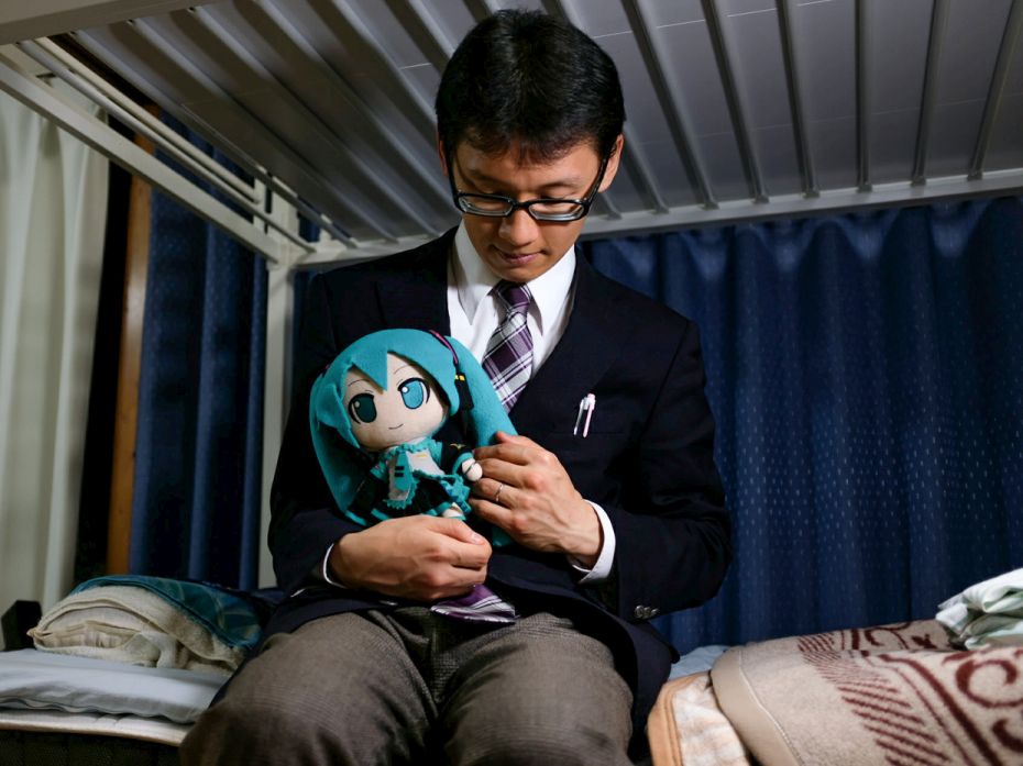 VIRTUAL WIFE, JAPAN 
Akihiko Kondo (35), a Tokyo school administrator, poses for a photograph 