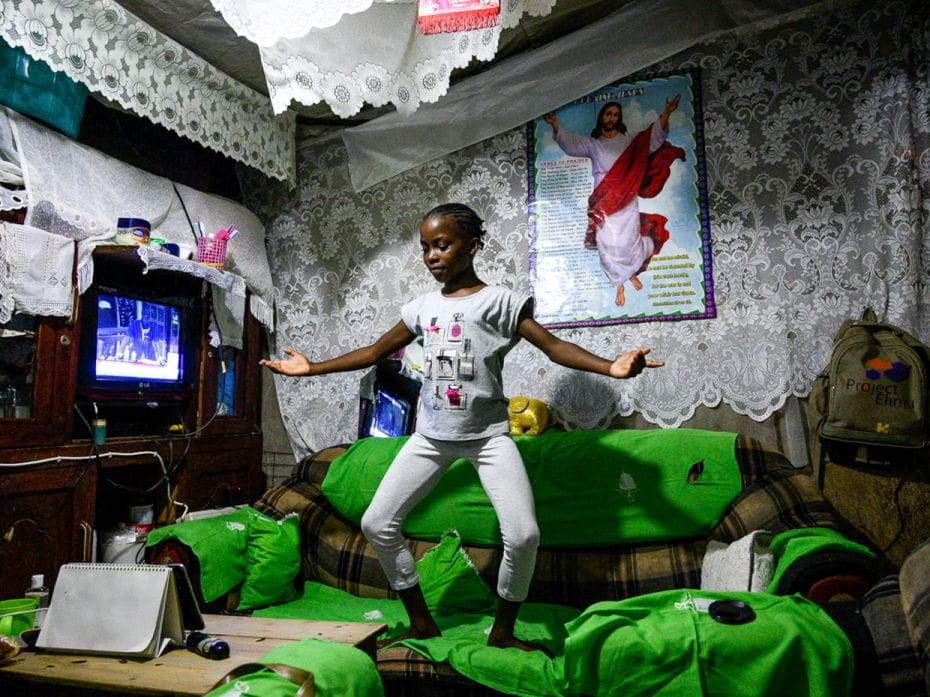 SOARING BALLET, KENYA
Lydia Akoth (10), a member of Project Elimu, practises dancing on a sofa at h