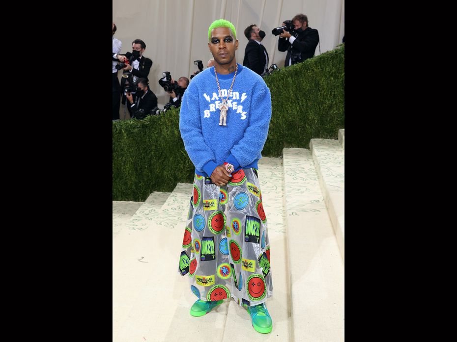 Musical artist Kid Cudi debuted acid green hair at the Met Gala 2021 carpet. He brought the 'angsty'