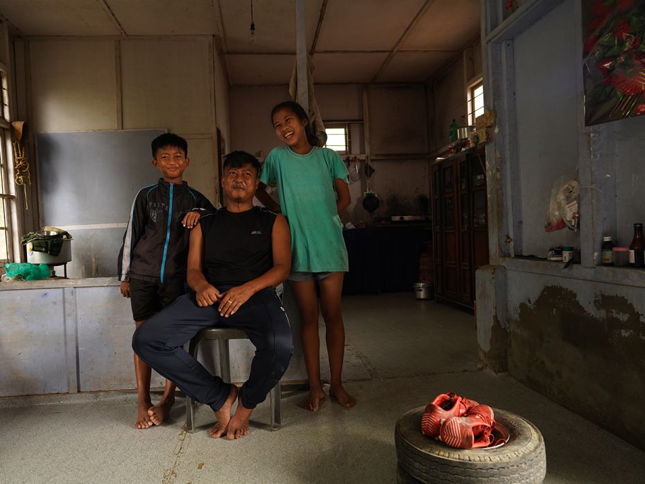 Rickshaw driver Lalchawiliana with his daughter Vanlalnghaki (13) and son Lalthazuala (12) in their 