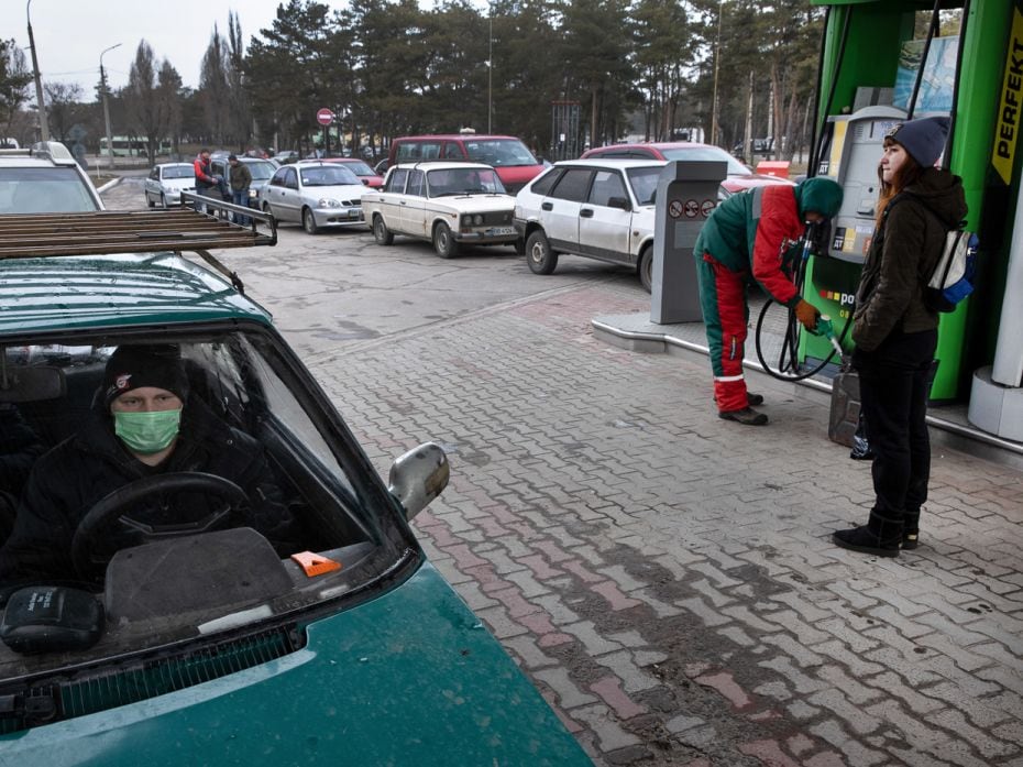 People line up for fuel in Severodonetsk, eastern Ukraine, hours after Russian forces began to invad