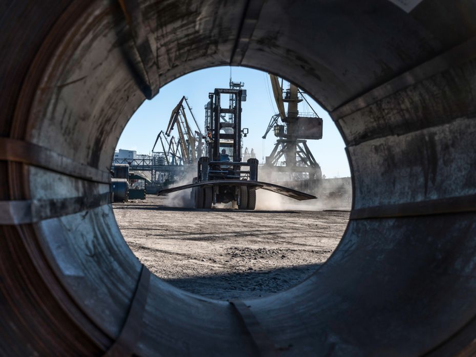 A forklift operator moves steel sheets at the Port of Mykolaiv in Ukraine, February 14, 2022. A Russ