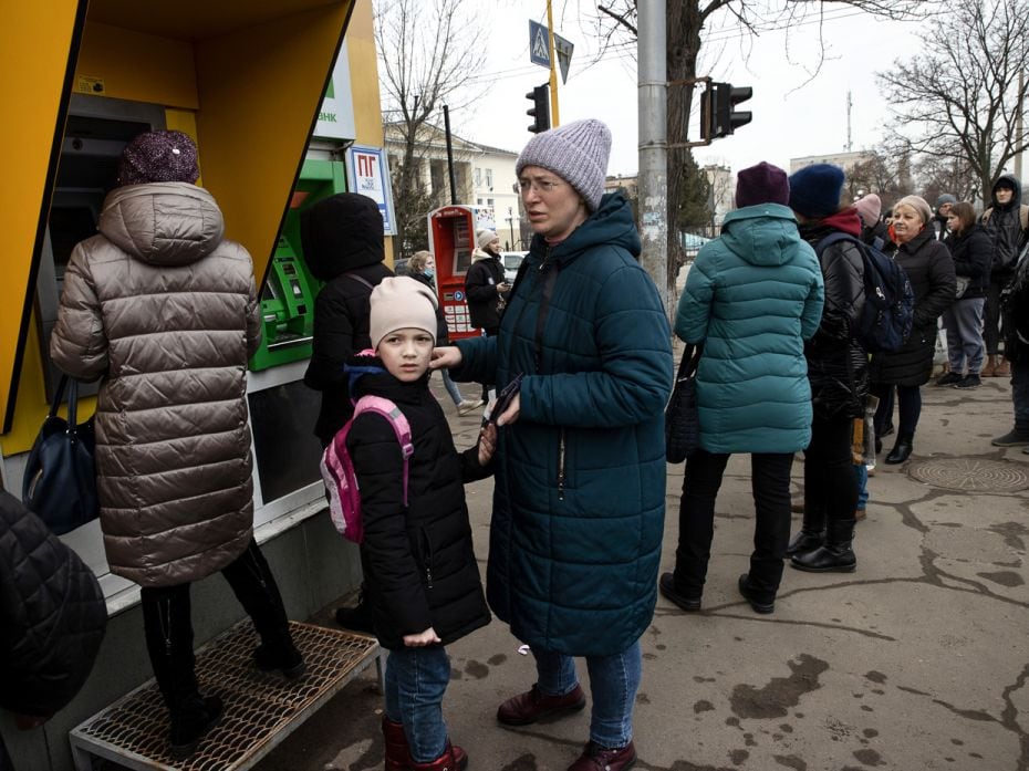 People withdraw cash from ATMs in Severodonetsk, in eastern Ukraine, on Thursday, February 24, 2022.