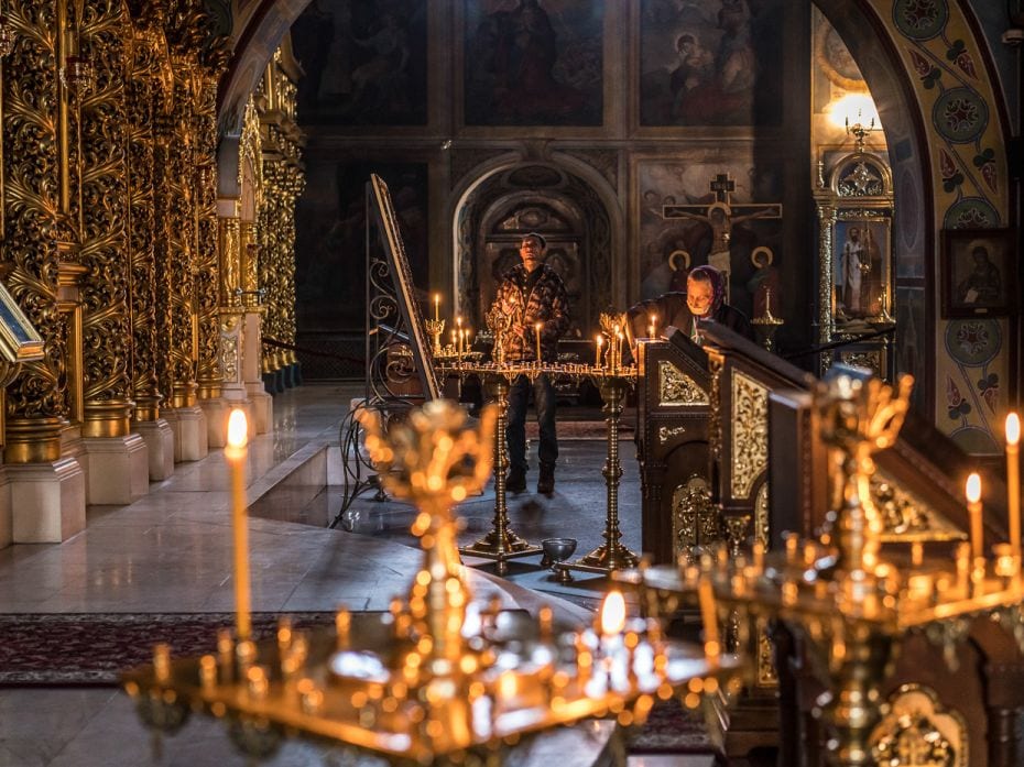 People pray at St. Michael's Golden-Domed Monastery in Kyiv, the capital of Ukraine, Thursday, Febru