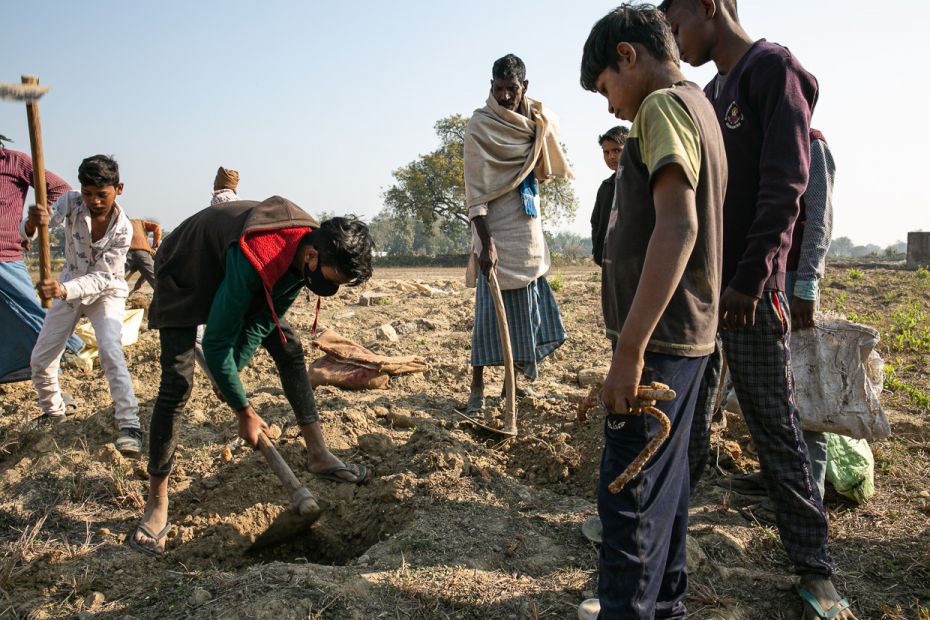 Deepak Rajbhar, a Class 10 student in Shivale, joins his neighbours as they dig for leftover bits of