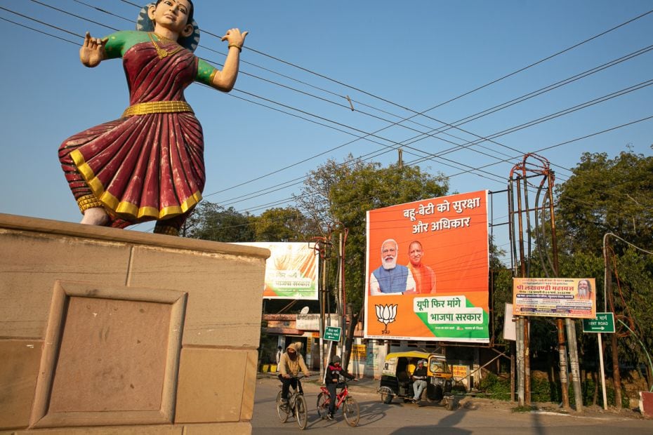 A large hoarding of the Bharatiya Janata Party featuring the Modi-Yogi combine flanks