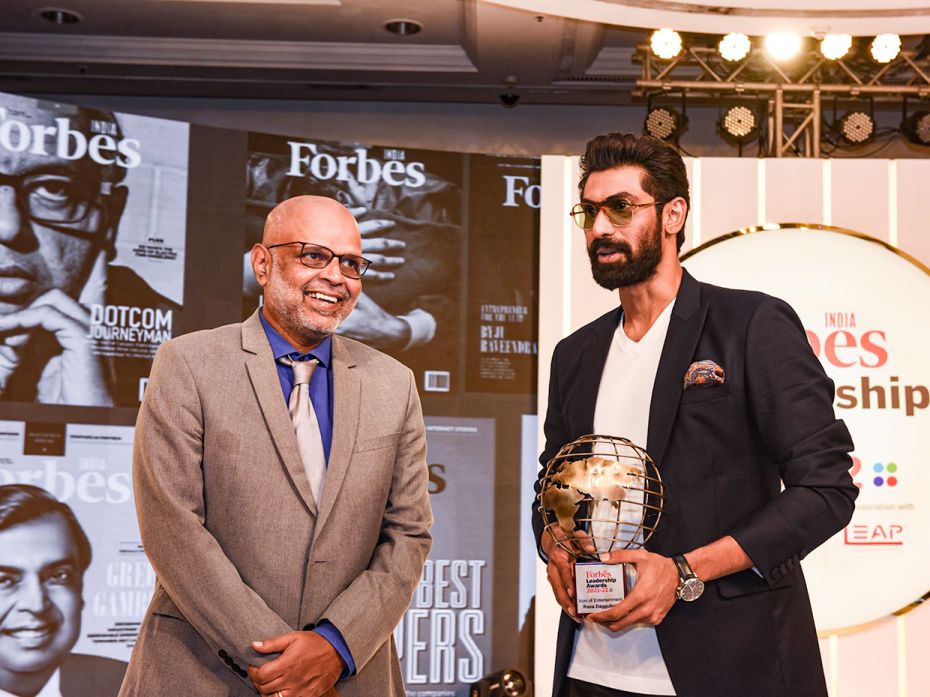 Rana Daggubati accepts the Icon of Entertainment special citation from Forbes India editor Brian Car