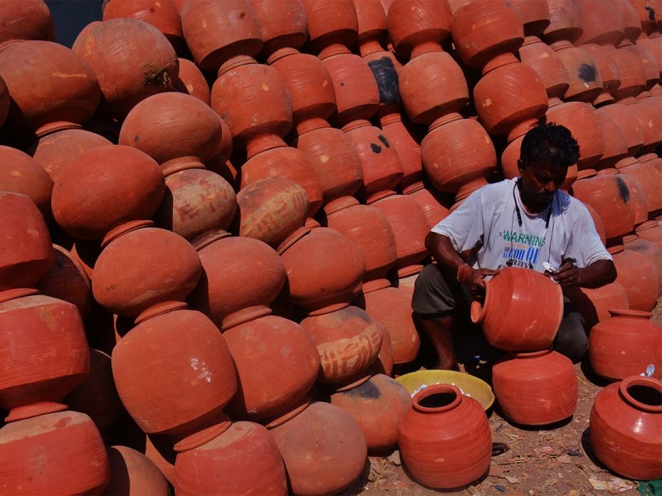 A potter makes earthen pots at Kumbharwada in Bhiwandi village as demand for these pots have increas