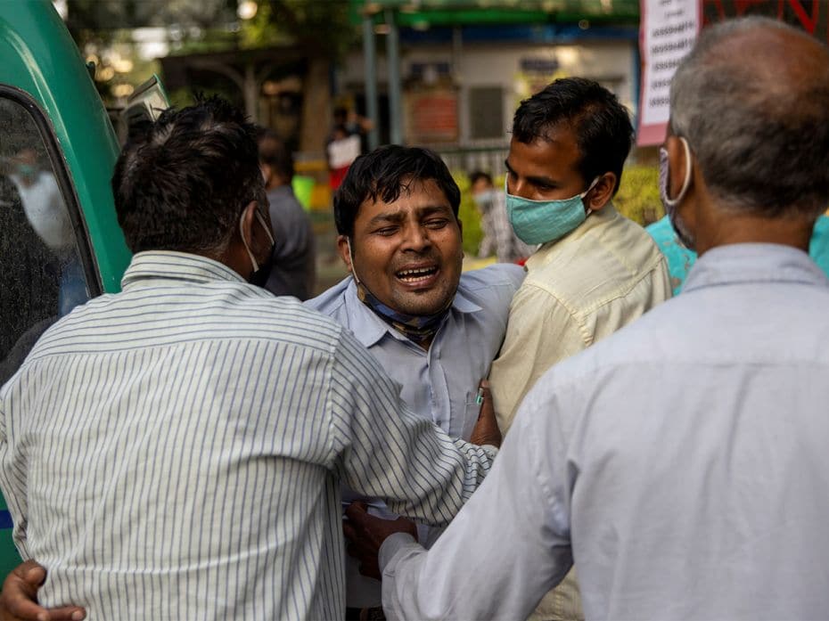 Family members mourn after Shayam Narayan is declared dead outside the Covid-19 casualty w