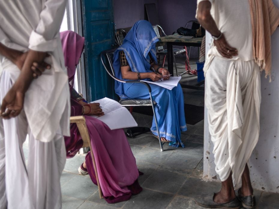 Deferential to custom but unbowed by her veil, ASHA worker Geeta Chaudry registers vaccine recipient