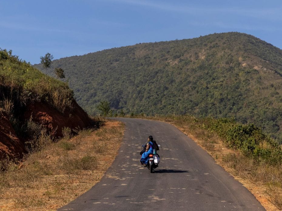 ASHA worker Reena Jani accepts her neighbour’s help—a ride to Mathalput Community Health