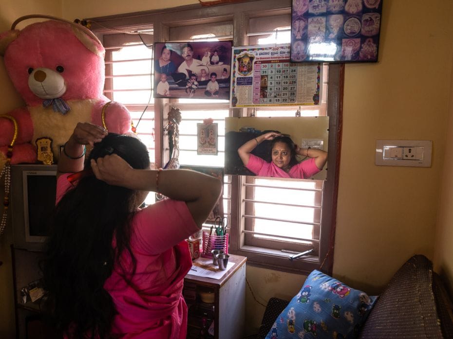 Sunitha K N, an ASHA worker, readies to leave home for work in Mysuru, Karnataka, on May 18, 2021. T