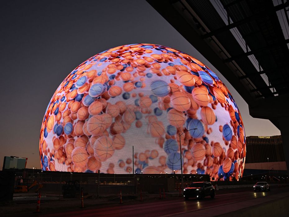 The MSG (Madison Square Garden) Sphere, a new music entertainment arena, is lit with basketballs to 