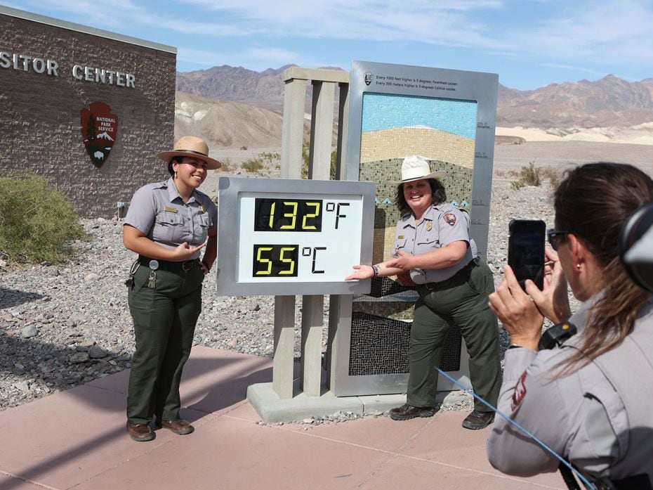 National Park Service Rangers Gia Ponce (L) and Christina Caparelli brave the heat and pose for a ph