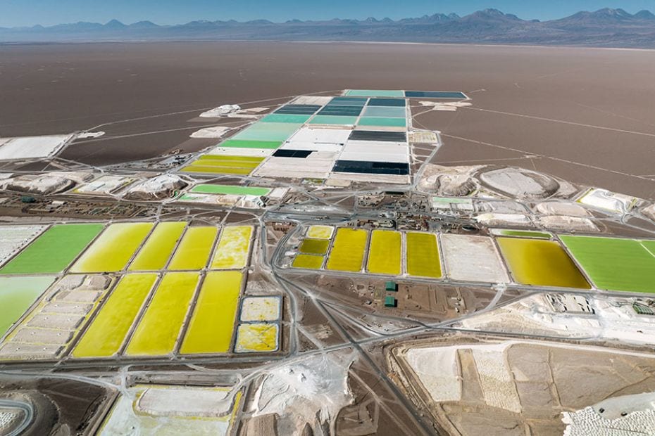 In this aerial view, brine pools containing lithium carbonate and mounds of salt stretch through a l