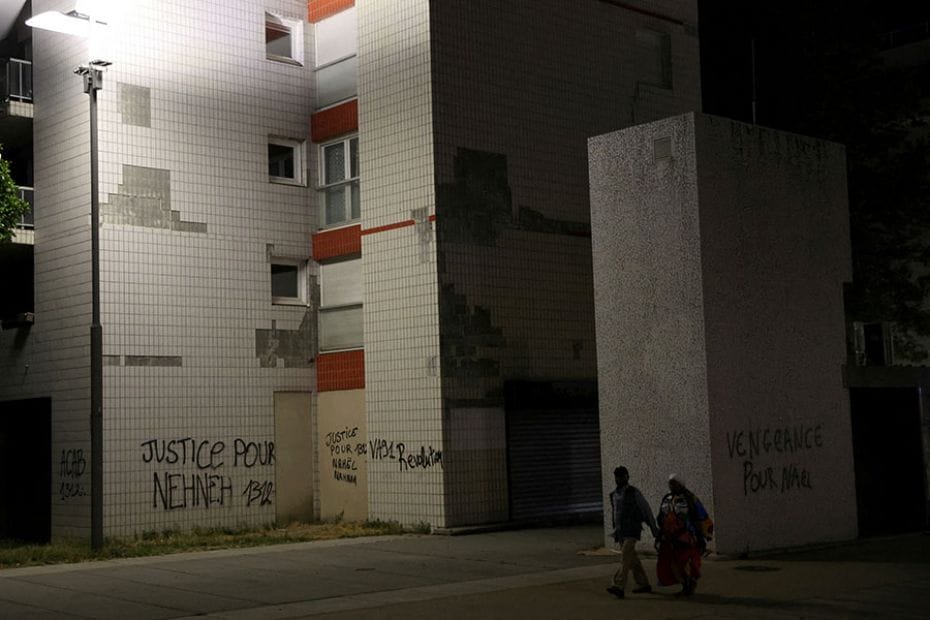 Residents walk past buildings in a neighbourhood in Nanterre, France, July 2, 2023. The unrest is a 