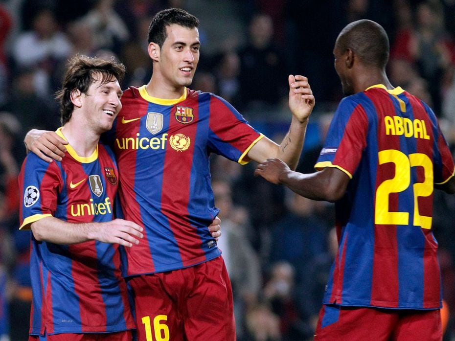 A file photo of Barcelona's Lionel Messi celebrating his second goal with teammate Sergio Busquets a