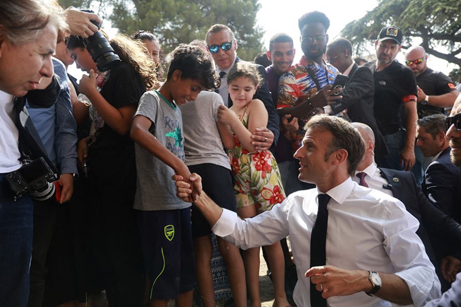 French President Emmanuel Macron visits the Benza district in Marseille, France, on June 28 2023. Ma