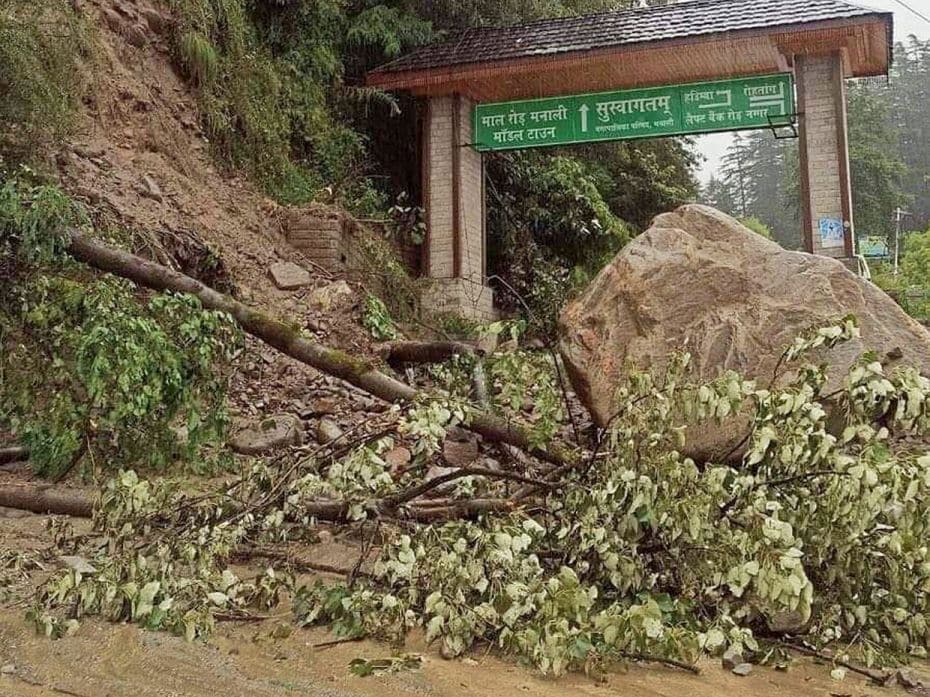 Boulders and debris block the entry gate to Mall Road in Manali following a landslide after cloudbur